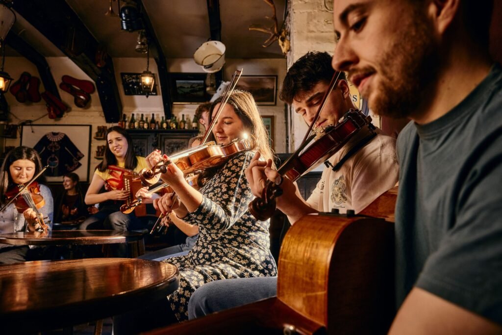 Traditional musicians playing a session at Kelly’s Cellars in Belfast