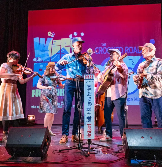 Musicians on stage at Westport Folk and Bluegrass Festival